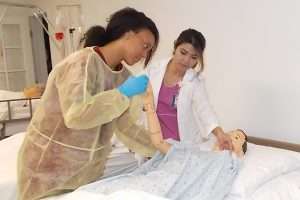 Nursing Assistant student participating in hands-on clinical experience